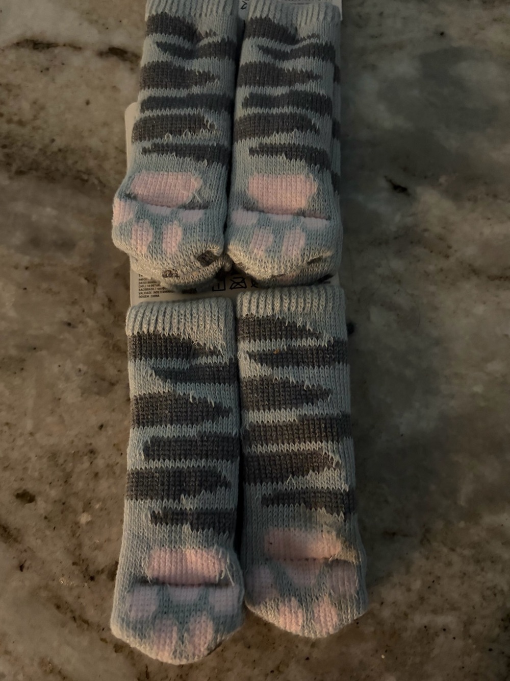 A set of eight cat paw chair leg protectors